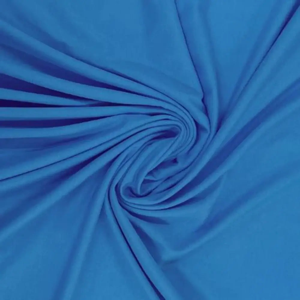 Malha PV na cor azul cobalto com ponto de tensão no centro, ilustrando a intensidade da cor e a textura macia.