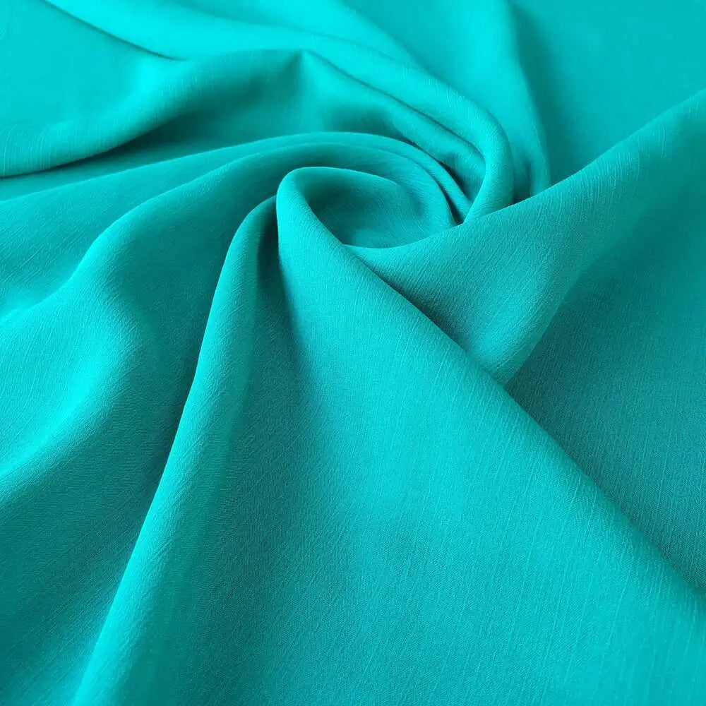 Chiffon musseline verde bandeira, ideal para vestidos esvoaçantes.